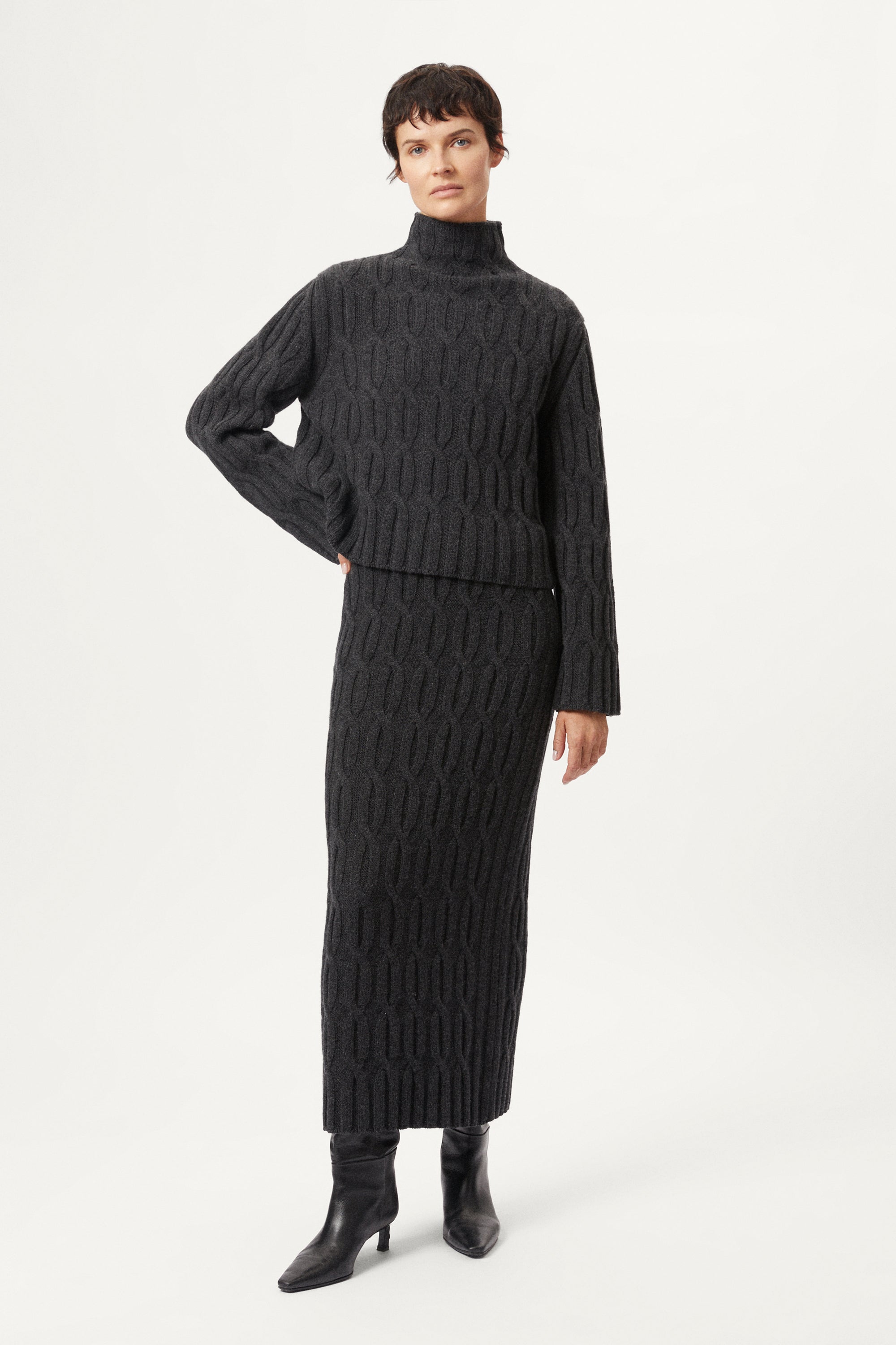 The Woolen Cable Knit Cropped High Neck - dark grey