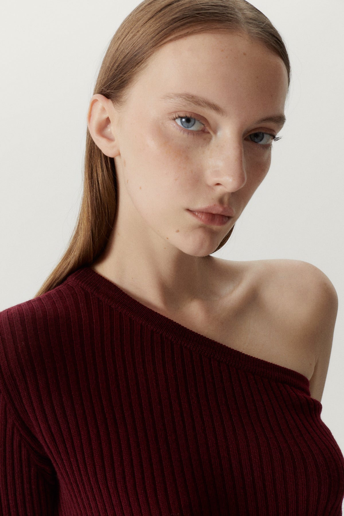the merino wool one shoulder top ruby red