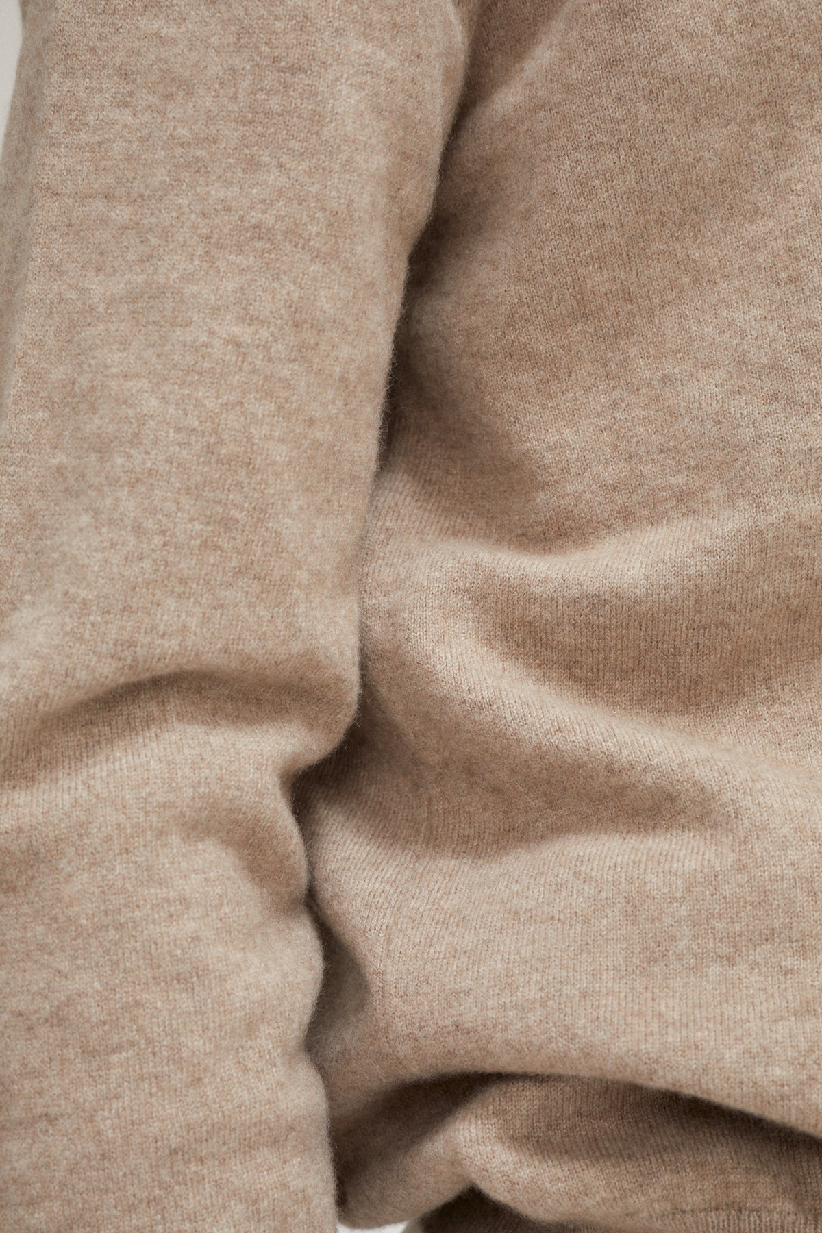 Close-up of beige fabric with a focus on texture and color.