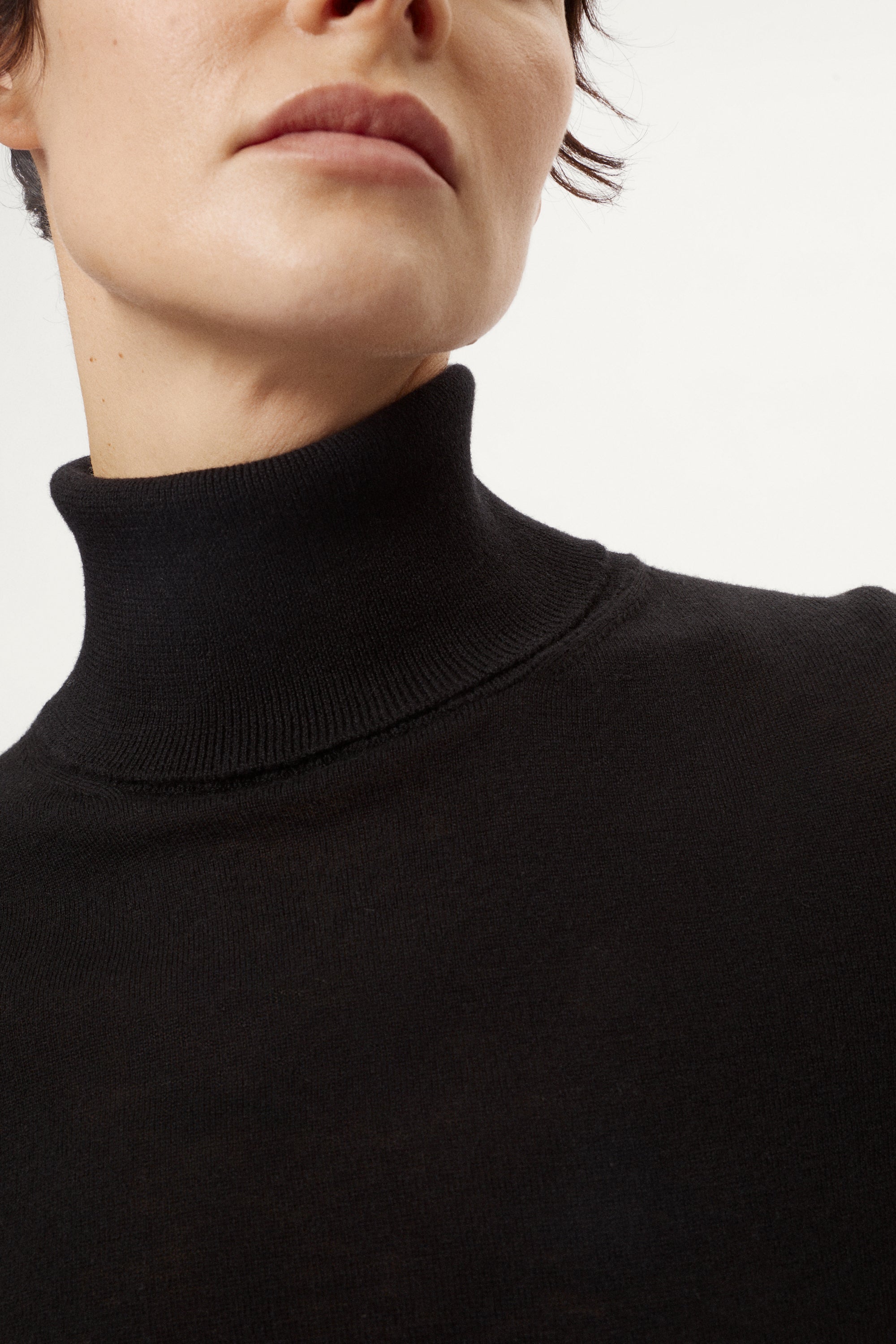 Person wearing a black turtleneck