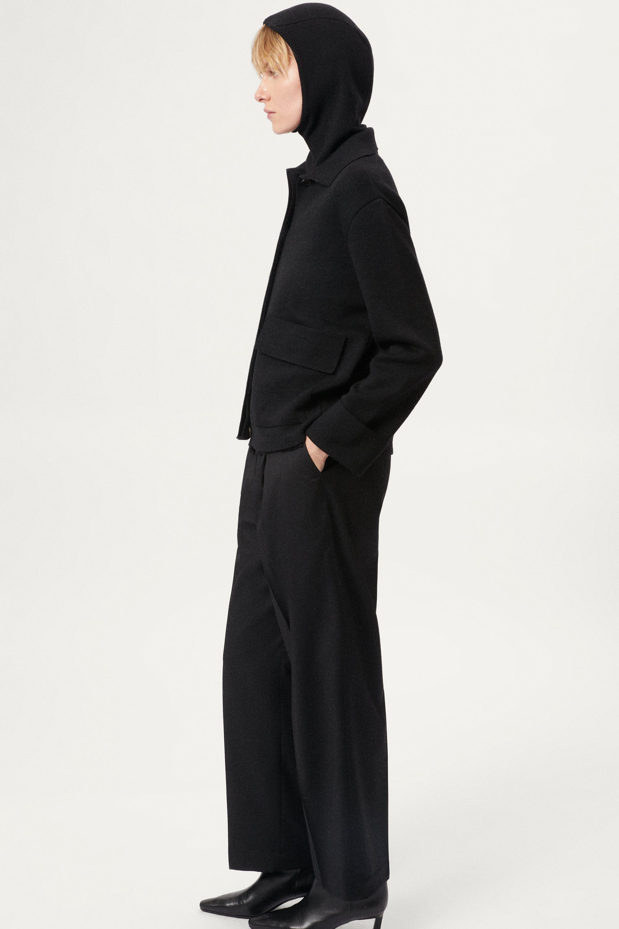 woman wearing a black ultrasoft miniclava against a white background