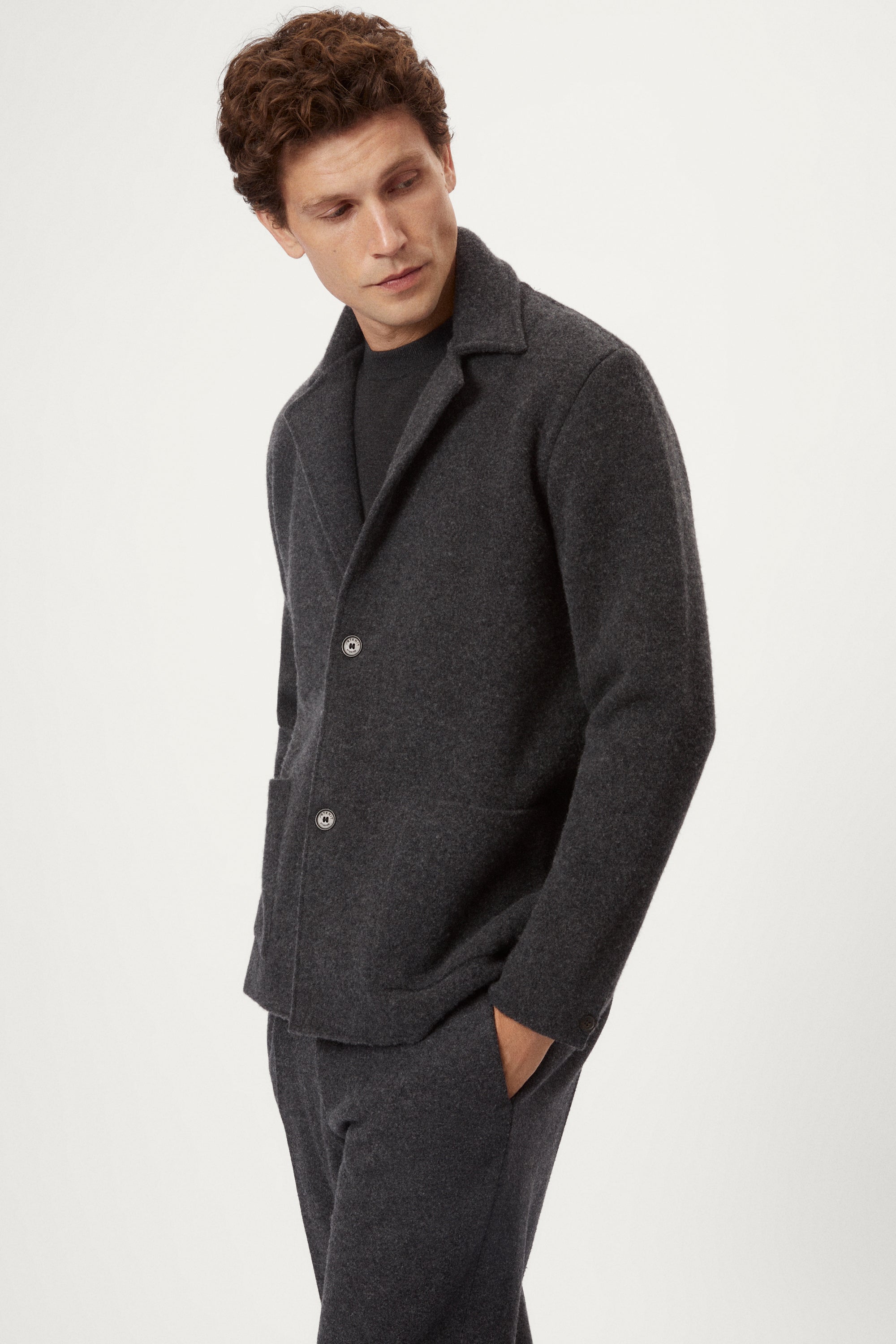 Man wearing a Woolen dark gray Jacket and pants 