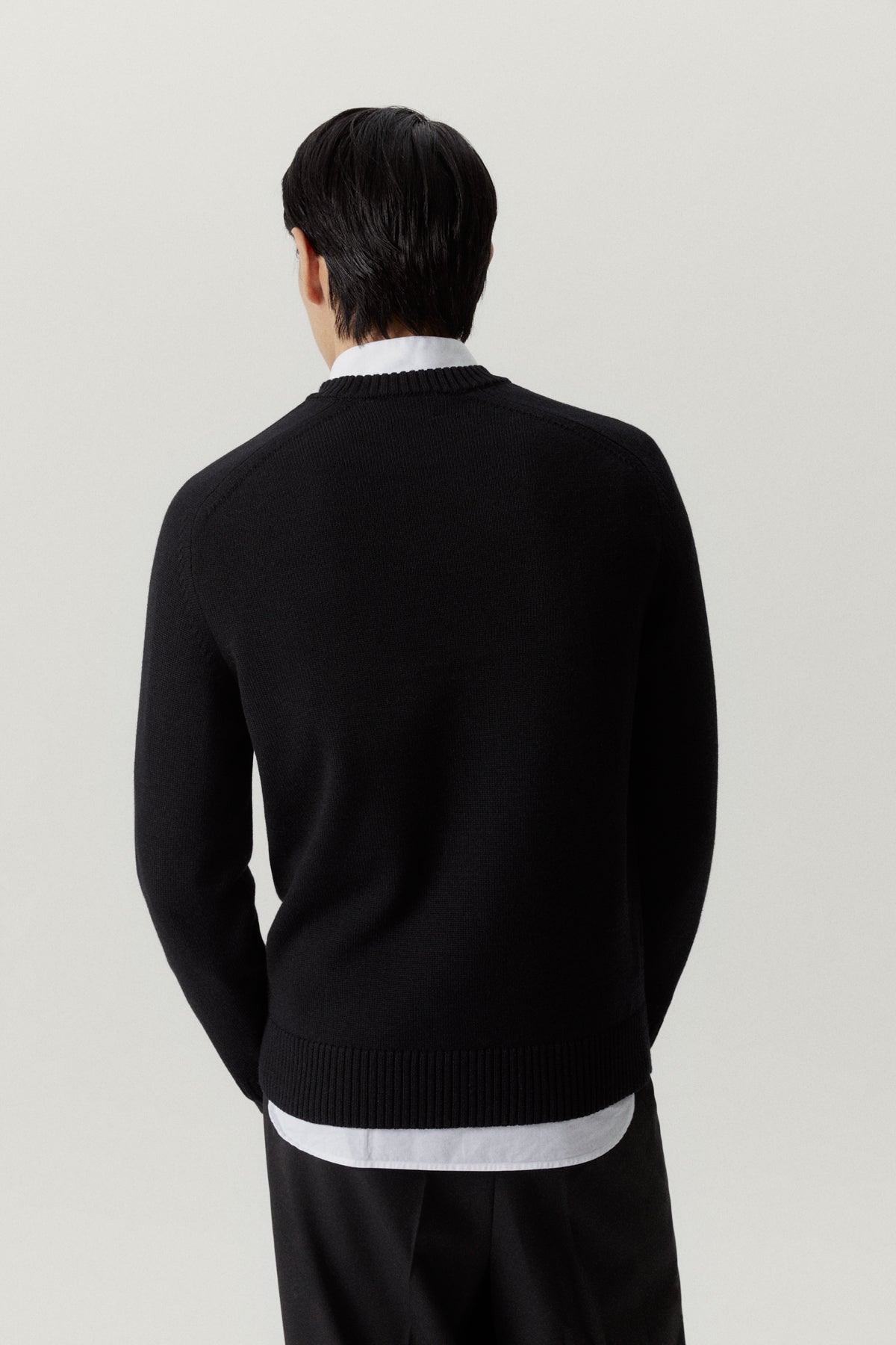 the merino wool saddle shoulder sweater black